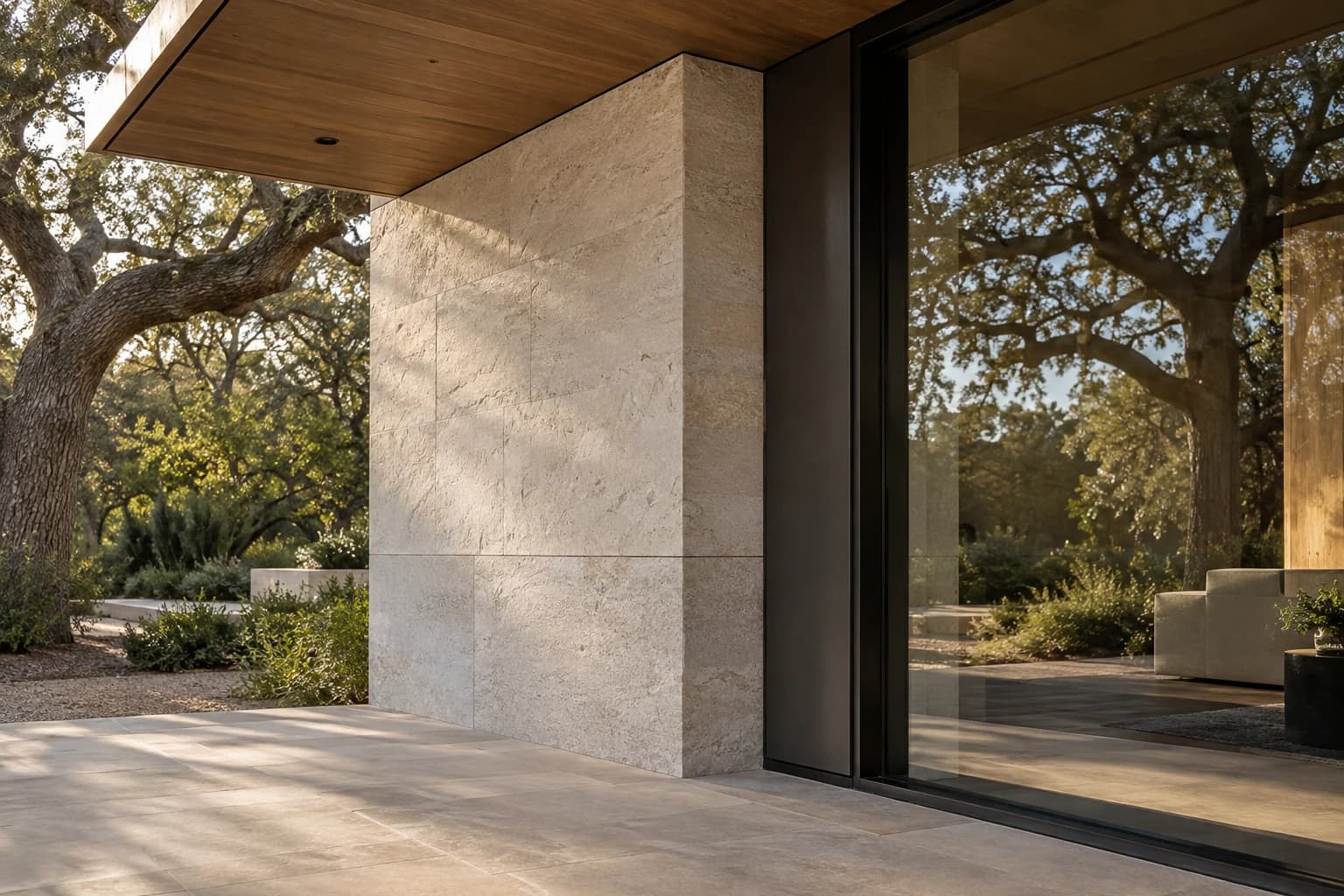 Illustrative built detail where limestone, timber soffit, and bronze-framed glazing meet
